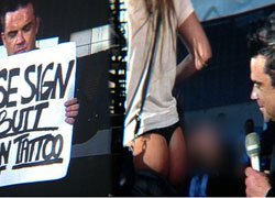 Robbie Williams... TANGALI HAYRANININ POPOSUNU İMZALADI!