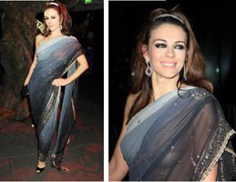 Elizabeth Hurley...DAVETE SÜTYENSİZ ŞEFFAF ELBİSEYLE KATILDI!...